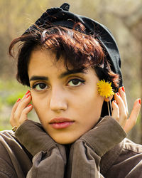 Portrait of young woman looking at camera