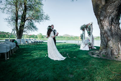 People on field by trees