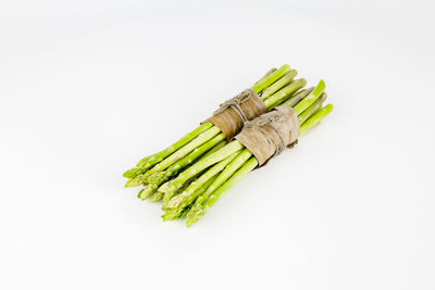 High angle view of green chili pepper against white background