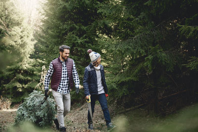 Father and son walking in forest