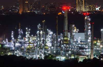 High angle view of illuminated buildings in city at night