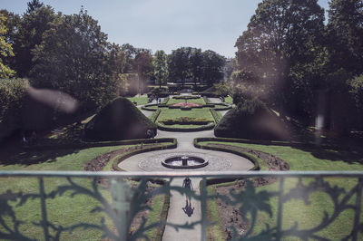 Fountain and trees against sky