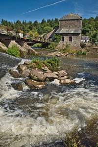 View of river flowing through rocks