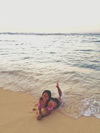 Woman sitting on beach