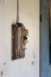Close-up of old padlock on wall