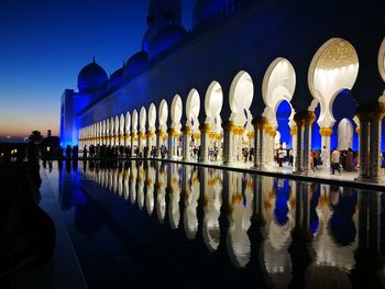 Panoramic view of illuminated building at night