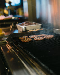 Close-up of meat on barbecue grill