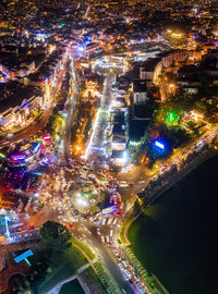 High angle view of illuminated buildings in city at night