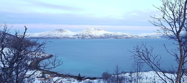 Scenic view of snowcapped mountains against sky