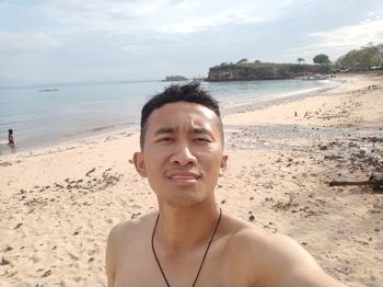 Portrait of young man on beach