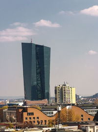 Modern buildings in city against sky