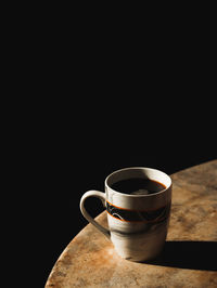 Close-up of coffee cup on table