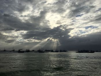 Scenic view of sea against cloudy sky