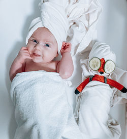 Portrait of cute baby boy sleeping on bed