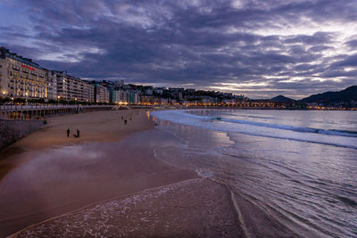 Scenic view of beach against sky during winter