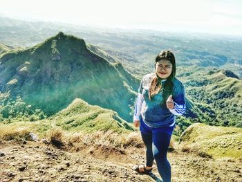 Portrait of woman against mountains