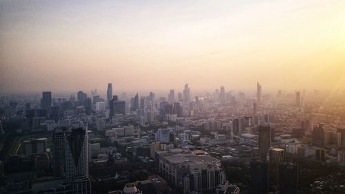 High angle view of modern buildings in city against sky