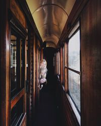 Sisters peeking through window while traveling in train