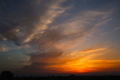 Low angle view of dramatic sky during sunset