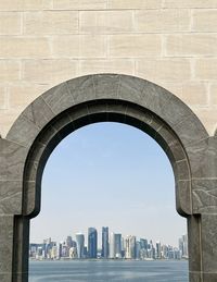Arch over sea in city