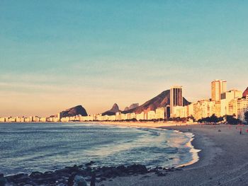 Beach and buildings against sky