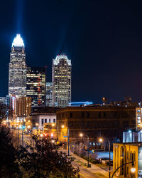 Illuminated buildings in city at night