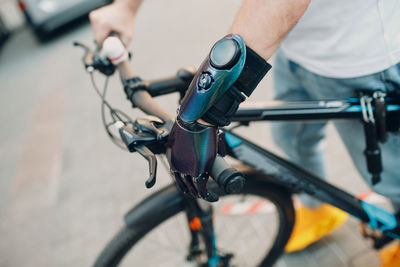 Cropped image of man riding bicycle