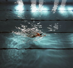 High angle view of man swimming in pool