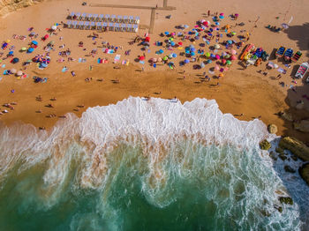 High angle view of multi colored umbrellas on beach