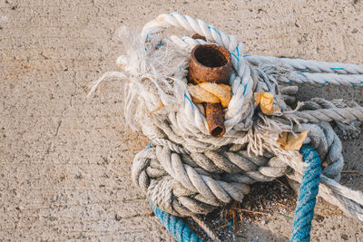 High angle view of ropes tied on metal