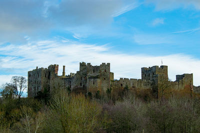 Low angle view of old buildings against sky