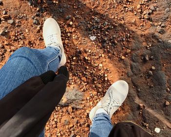 Low section of person standing on land