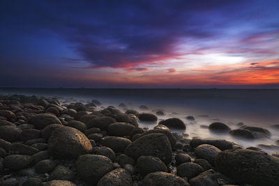 Scenic view of sea against sky at sunset