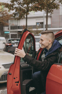 Man sitting in car