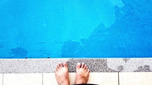 Low section of man at poolside