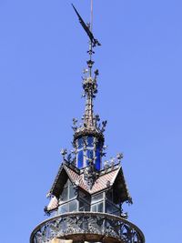 Low angle view of traditional building against clear blue sky