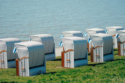 Wicker beach chair in a row at the sea