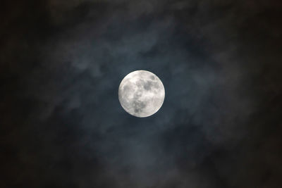 Low angle view of moon against sky at night