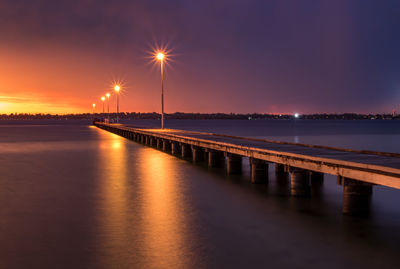 Scenic view of sea against sky at night