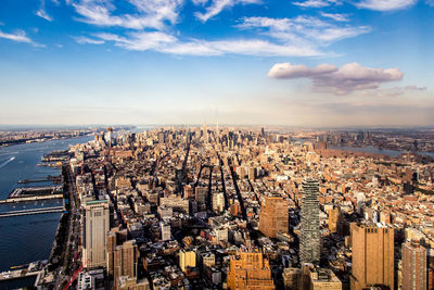 High angle view of cityscape against cloudy sky