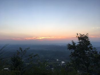 Scenic view of landscape against sky during sunset