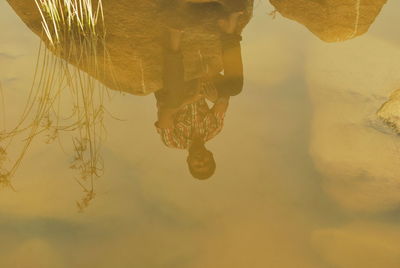 High angle view of reflection in lake against sky