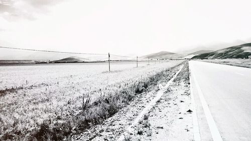 Road passing through field