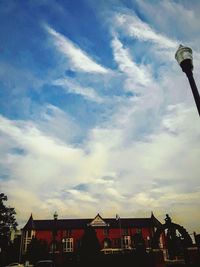 Low angle view of silhouette buildings against sky