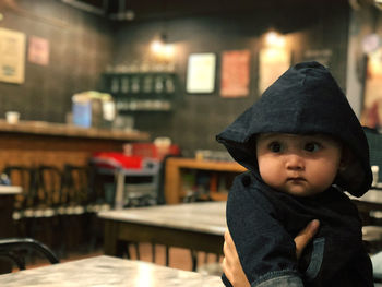 Portrait of cute boy in restaurant