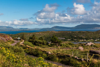 Scenic view of landscape against cloudy sky