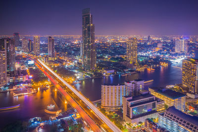 High angle view of illuminated cityscape at night