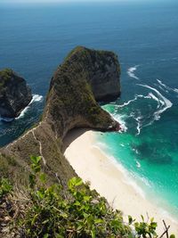 High angle view of rocks on beach against sky