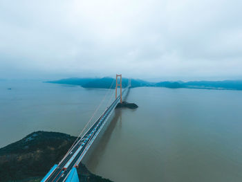 High angle view of bridge over sea against sky