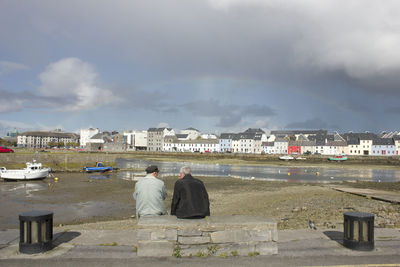 Houses against cloudy sky